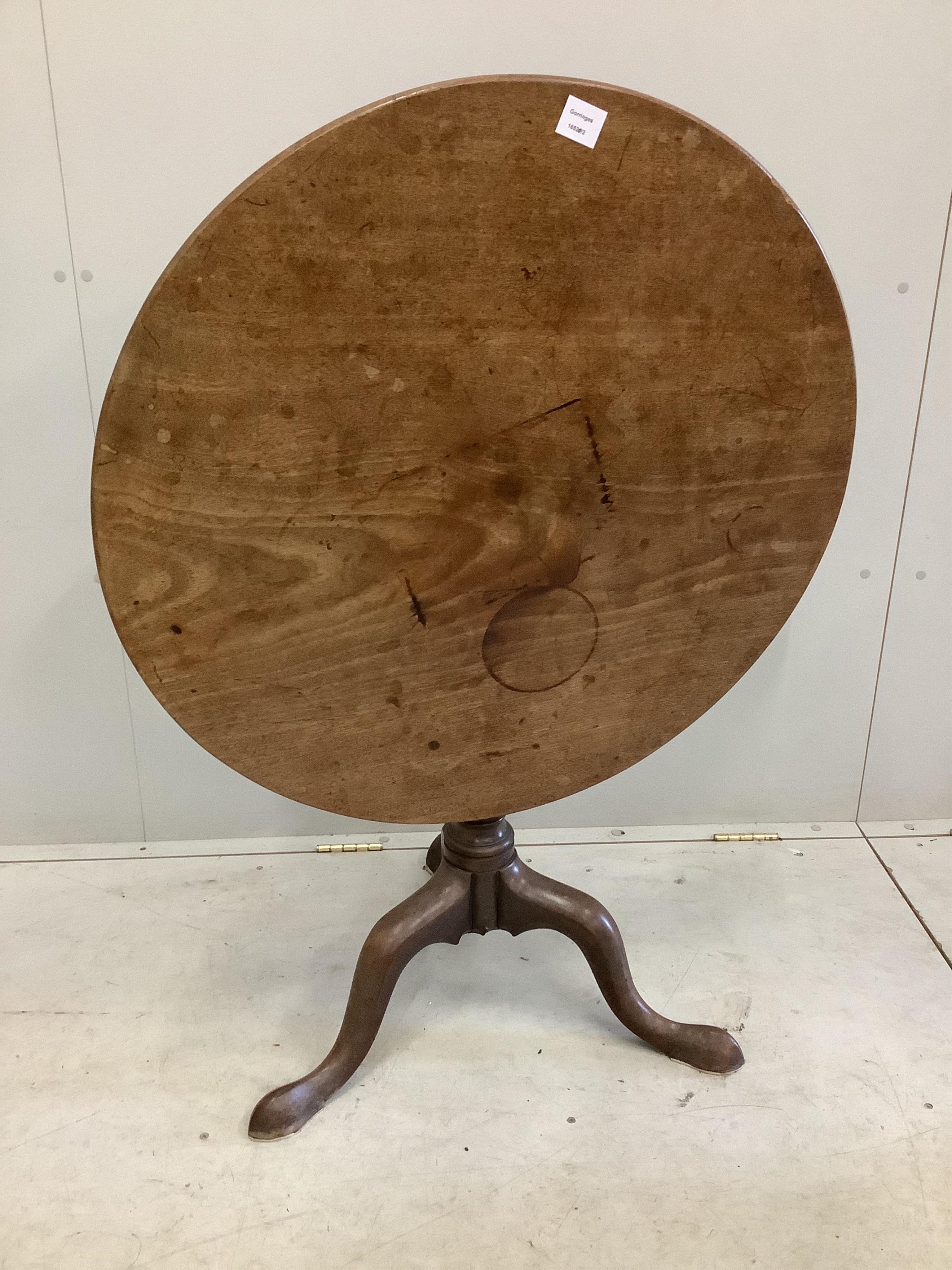 A George III mahogany circular tilt top tea table, diameter 80cm, height 68cm. Condition - poor to fair